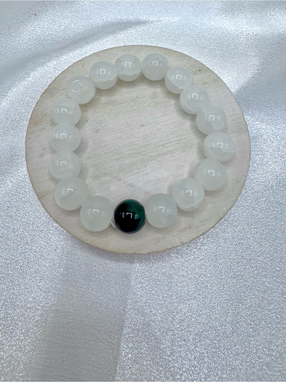 White Beaded Bracelet with Single Dark Accent Bead